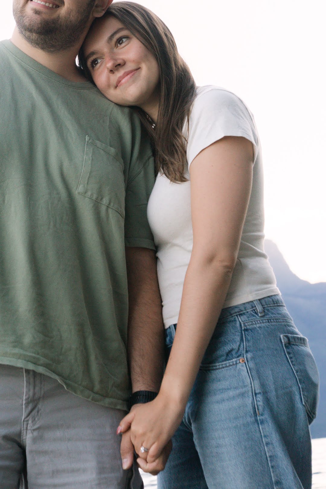 Jolan resting her head on Parker's shoulder