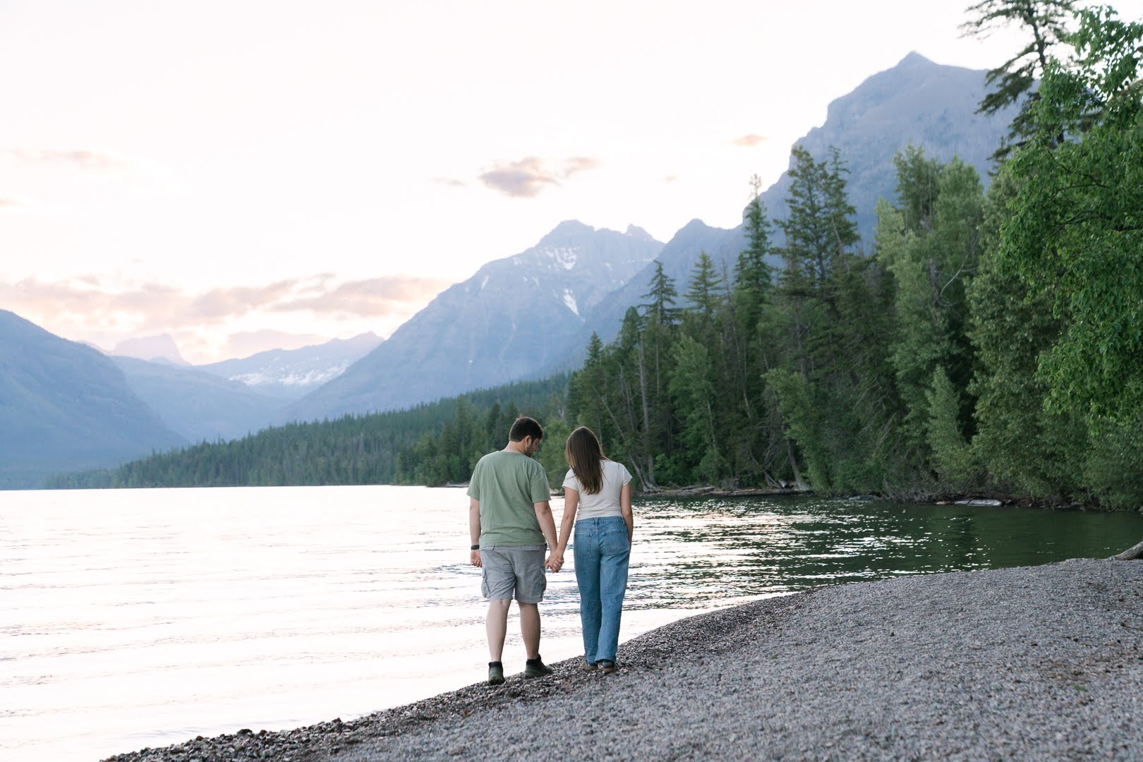 Parker and Jolan walking hand in hand along the shore